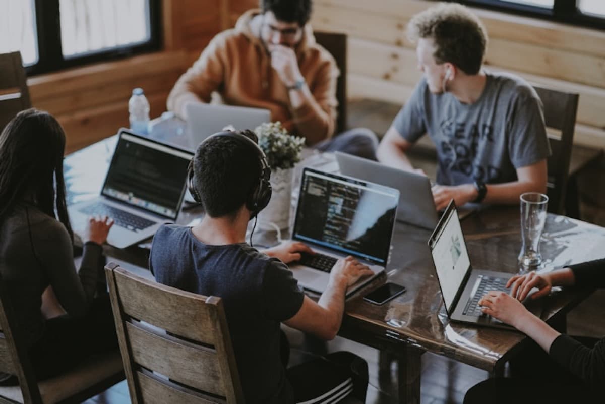 Brokerage team collaborating around a table in a bright office